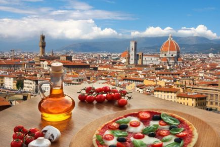 Uitzicht over Florence met een pizza